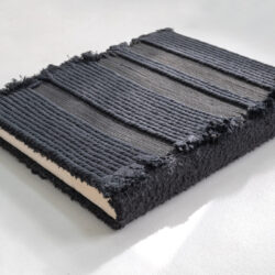 Black Book (back cover), 2025, 15 x 13 x 2", repurposed album (paper, board, book cloth), assorted cord/yarn, netting